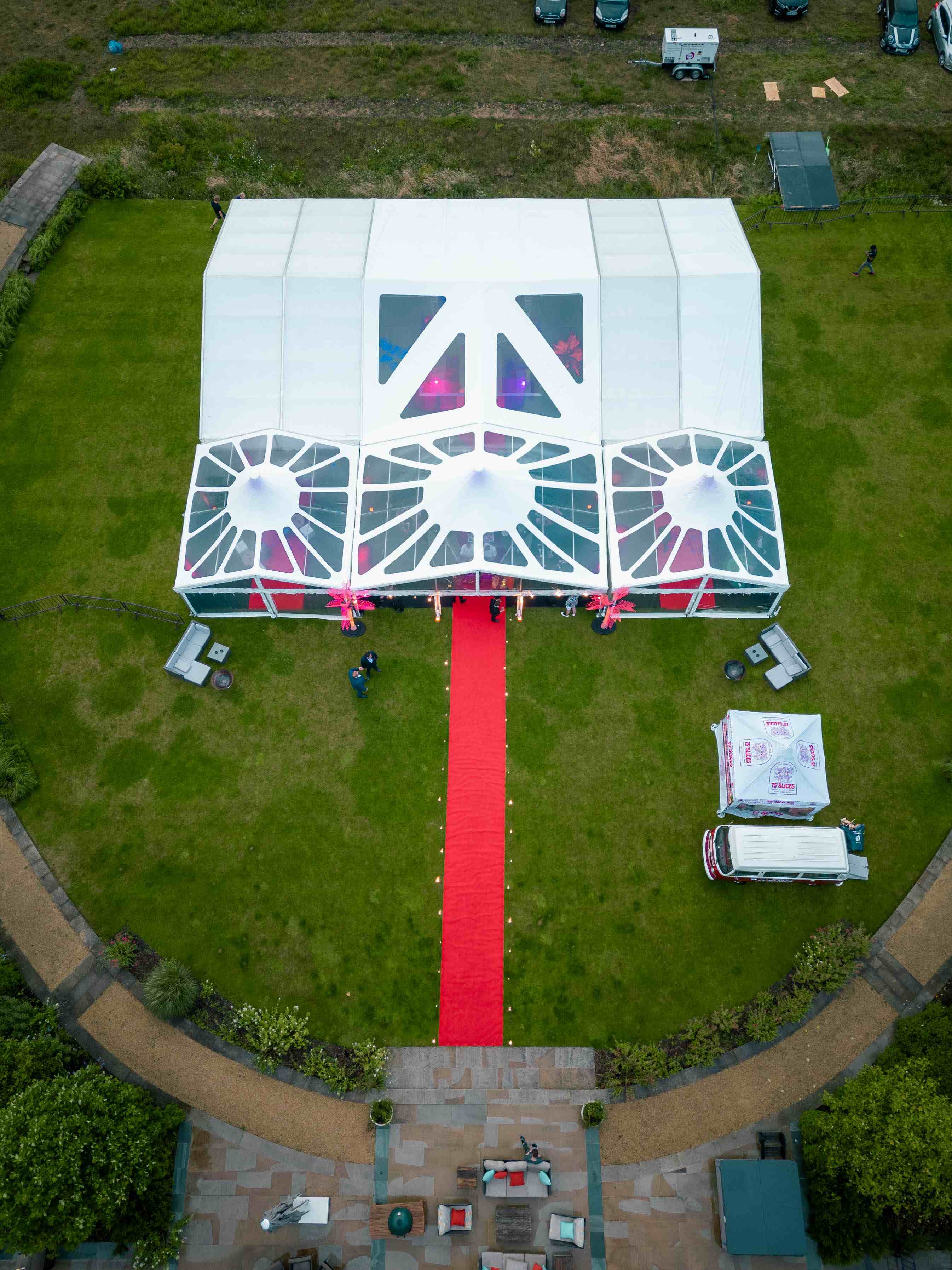 Aerial shot of a triple peaked marquee. 